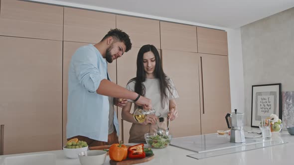 Latin Couple Making Vegetable Salad Together