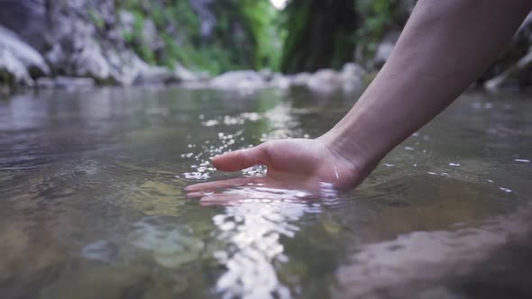 The moment when a graceful hand emerges from the water.