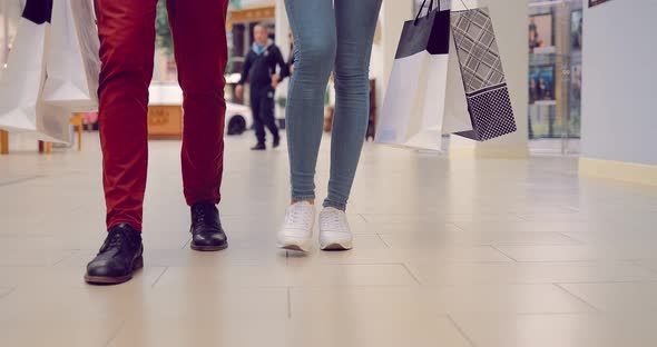 Couple with Bags Go to the Mall