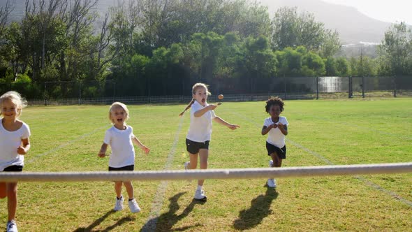 Children playing lemon and spoon race