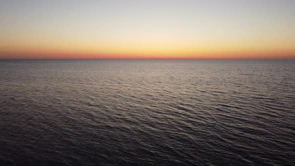 View of the Quiet Calm Sea with a Mesmerizing Sea Sunset the Sun Goes Into the Sea Beyond the