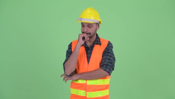 Stressed Young Bearded Persian Man Construction Worker Thinking