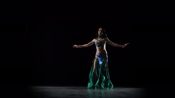 Girl Oriental Belly Dancer. Black Background