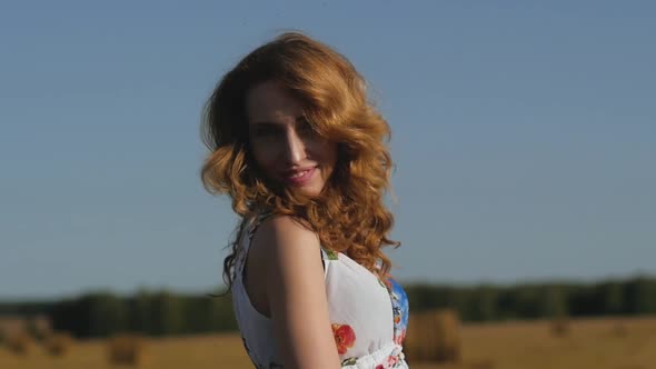 Portrait of a Redhead Woman Enjoying Beautiful Nature in the Countryside