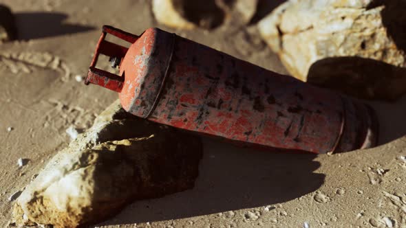 Old Rusted Gas Tank on Sand Beach