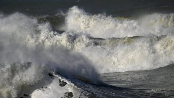 Slow Motion Shot of Huge Ocean Waves Crushing. Big Ocean Surfing Wave Breaking