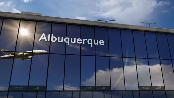 Airplane landing at Albuquerque USA, New Mexico airport mirrored in terminal