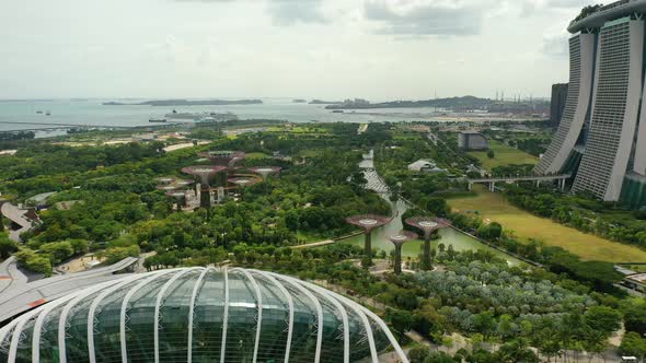 Gardens By The Bay, Flying Towards Skyline Singapore. Marina Bay In Singapore.
