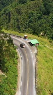 Mountain Road with Car Aerial Vertical View