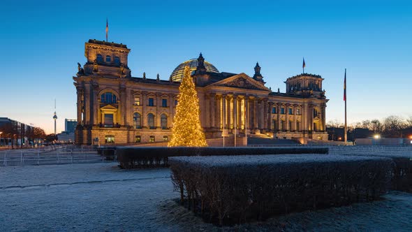 Night to Day Time Lapse with christmas tree in front of Reichstag Building in Berlin, Germany
