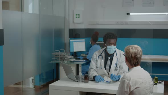 Medic of African American Ethnicity with Face Mask