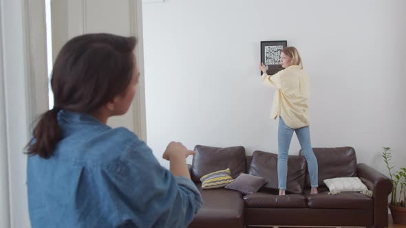 Two Young Happy Woman Hipster Move Into New Apartment