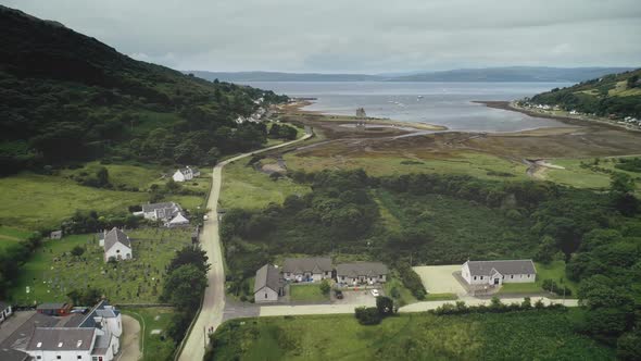 Scottish Island Timelapse Aerial View Mountains Village Whiskey Distillery Castle on Seashore