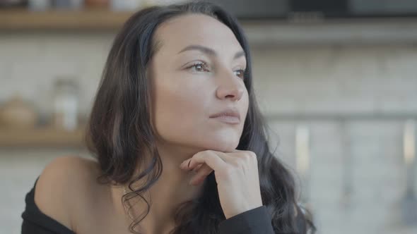 Closeup of Beautiful Brunette Young Slim Woman with Brown Eyes Looking Away Thinking