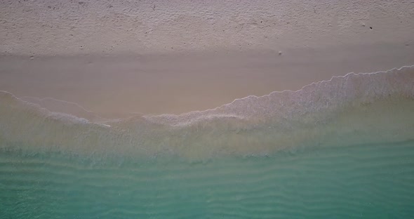 Daytime drone clean view of a white paradise beach and blue water background in best quality 4K