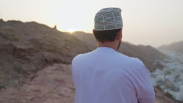 Omani Man  Looking At City