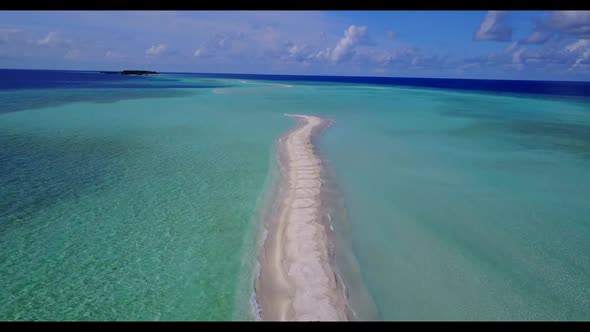 Aerial drone view seascape of tranquil shore beach trip by shallow lagoon with white sand background