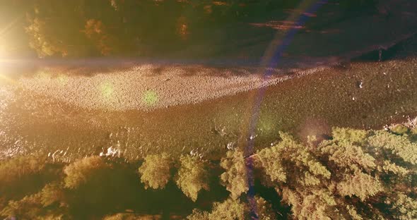 Low Altitude Flight Over Fresh Fast Mountain River with Rocks at Sunny Summer Morning