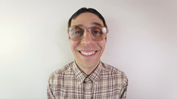 Portrait of Funny Nerd in Glasses