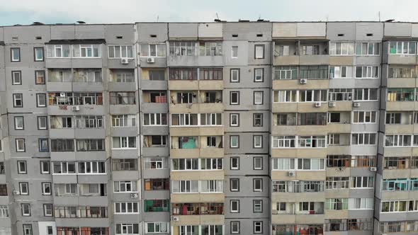 Residential Multistory Building, Aerial View. Flying Near Facade with Windows