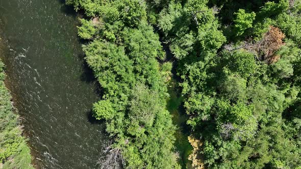 Aerial view looking down at the Provo River as people raft down it