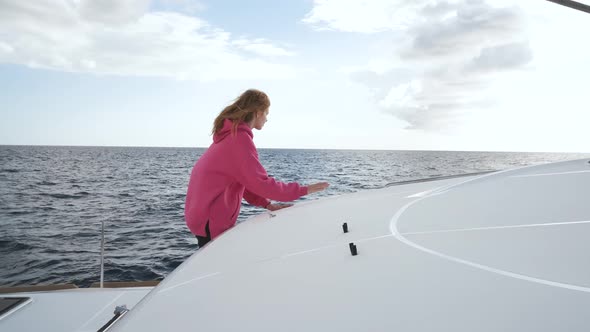 Beautiful White Yacht Breaks the Waves