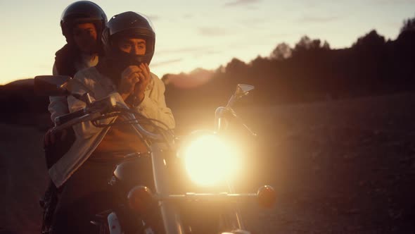 Man Turns Off Cruiser Motorbike With Bright LED Headlight At Night.