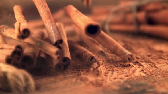 Super Slow Motion Fragrant Cinnamon Sticks Fall on the Table