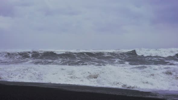 White Stormy Waves Coming In To Black Sand Beach