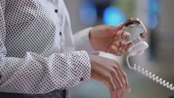 Female Shopper is Testing Smartwatch in Electronics Shop Holding New Model in Hands Closeup of Hands