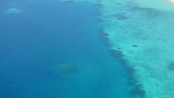 Aerial drone panorama of coast beach break by blue ocean with sand background