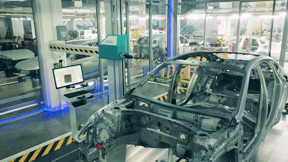 Car Carcass Being Inspected By Robotic Arms Car Plant