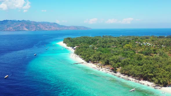 Aerial flying over scenery of marine tourist beach vacation by transparent ocean with bright sandy b