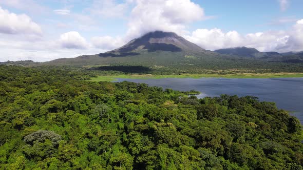 Largest lake of Costa Rica in front of Arenal volcano. Aerial footage of a world famous landmark in