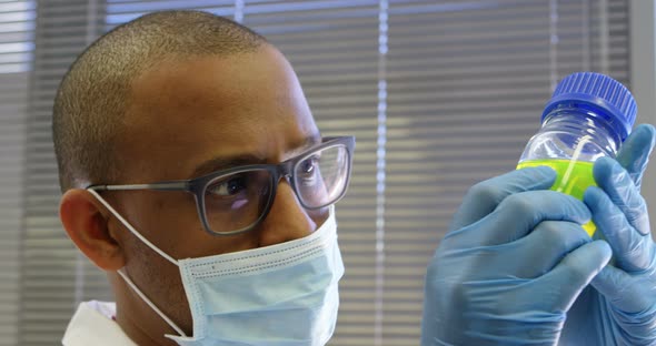 Scientist Examining Chemical Solution 4k alt