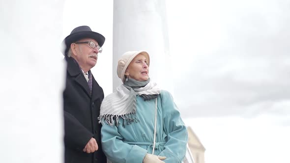 Old married couple in autumn city Park