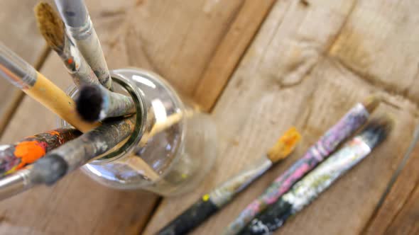 Various paintbrush in glass container