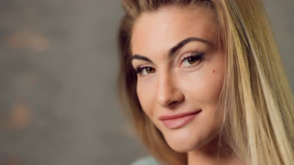 Caucasian Blonde Woman Looking at You Close View