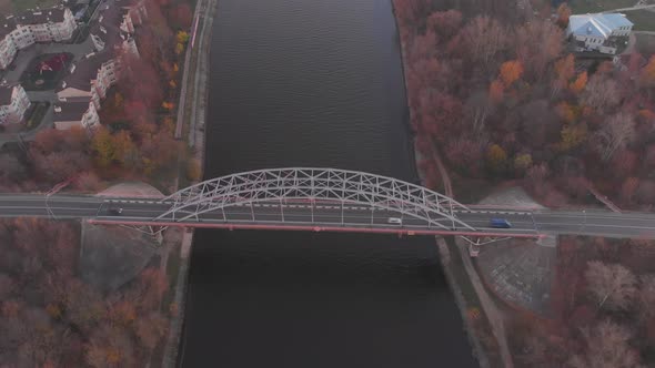 Flight Towards a Beautiful Bridge Across River. On the Bridge Passing Cars