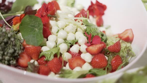 salad with strawberries mozzarella and flowers