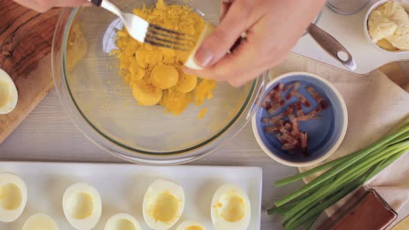 Preparing deviled eggs with organic eggs for appetizer. Step by step recipe.