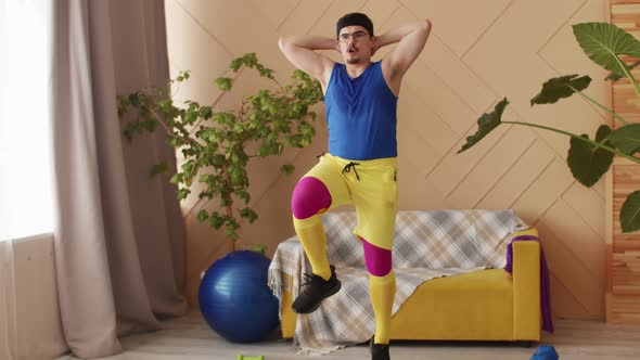 Chubby Fitness Man with a Moustache Glasses and Headband in Blue Yellow and Purple Retro Sportswear