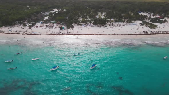 Aerial drone with lots of boats in the ocean. Tulum beach.