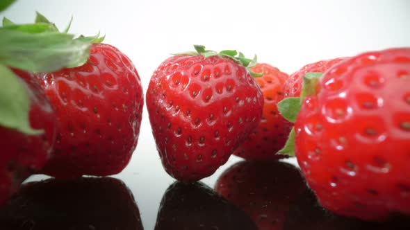 Ripe Fresh Natural Strawberries in Reflection in Extreme Macro Close Up