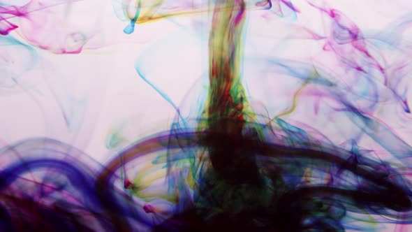 Colorful ink swirling around in water