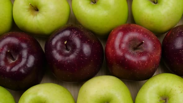 Many apples at wooden plate