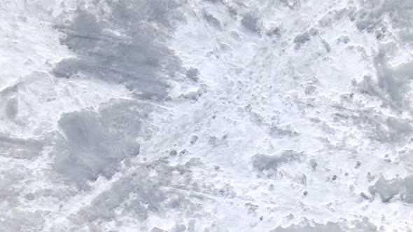 Top View of the Icy Sea. Ice Formations From the Air.