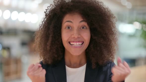 Excited Young African Businesswoman Celebrating Success