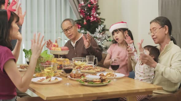 Happy family time and relationship, Asian big family eat food having small Christmas party together.