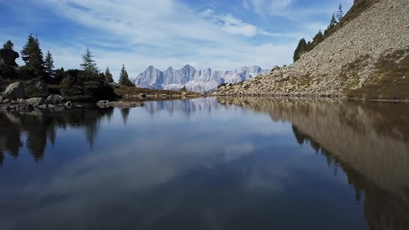 Flight Over Lake Spiegelsee with Reflections of Dachstein, Austria